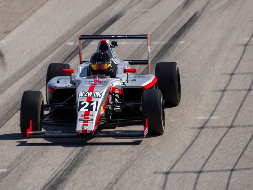 Strong Season Opener for BERG RACING in Ligier JFC at NOLA Motorsports Park 1 Berg Racing car #21 making its way through the race track with sharp maneuvering.